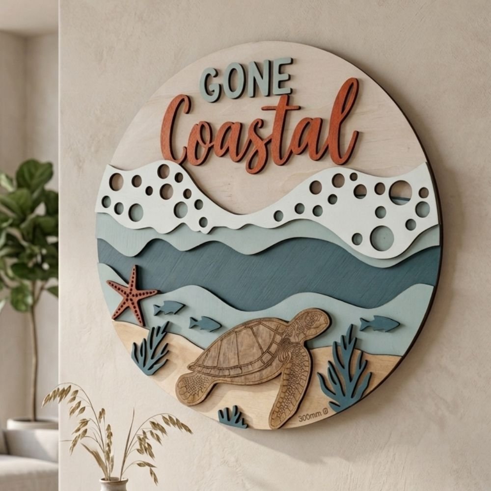 Round wooden wall art with layered waves, sea turtle and Gone Coastal text