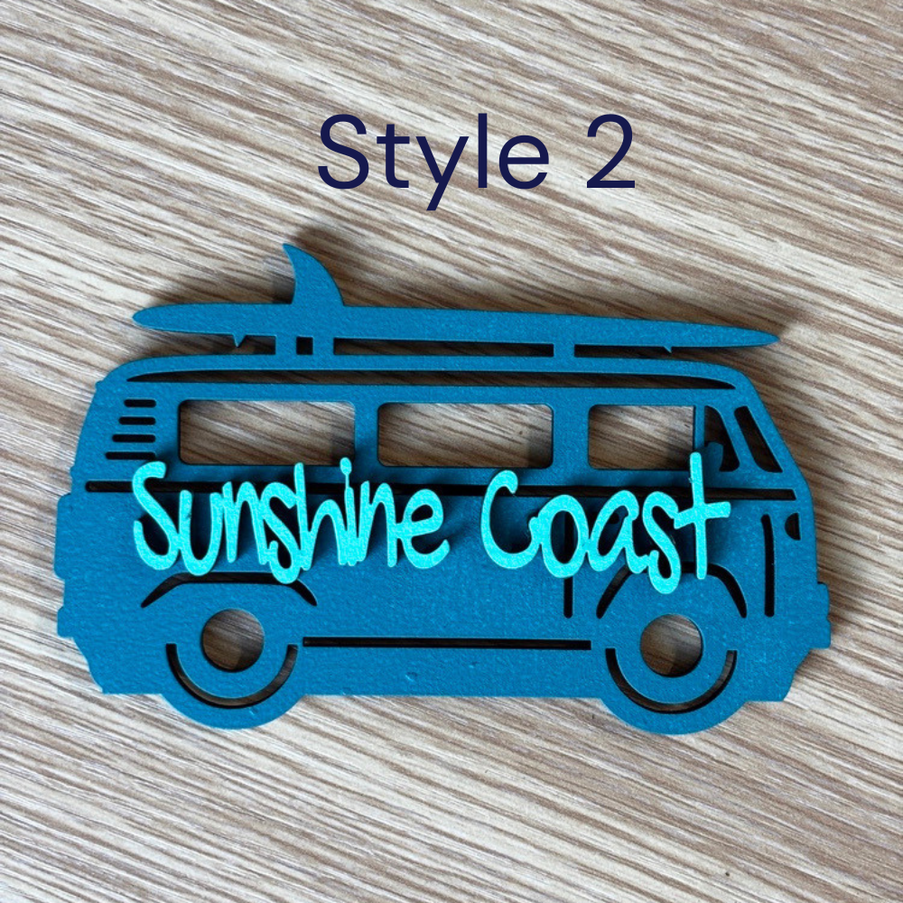 Blue coastal wooden beach magnet with decorative lettering