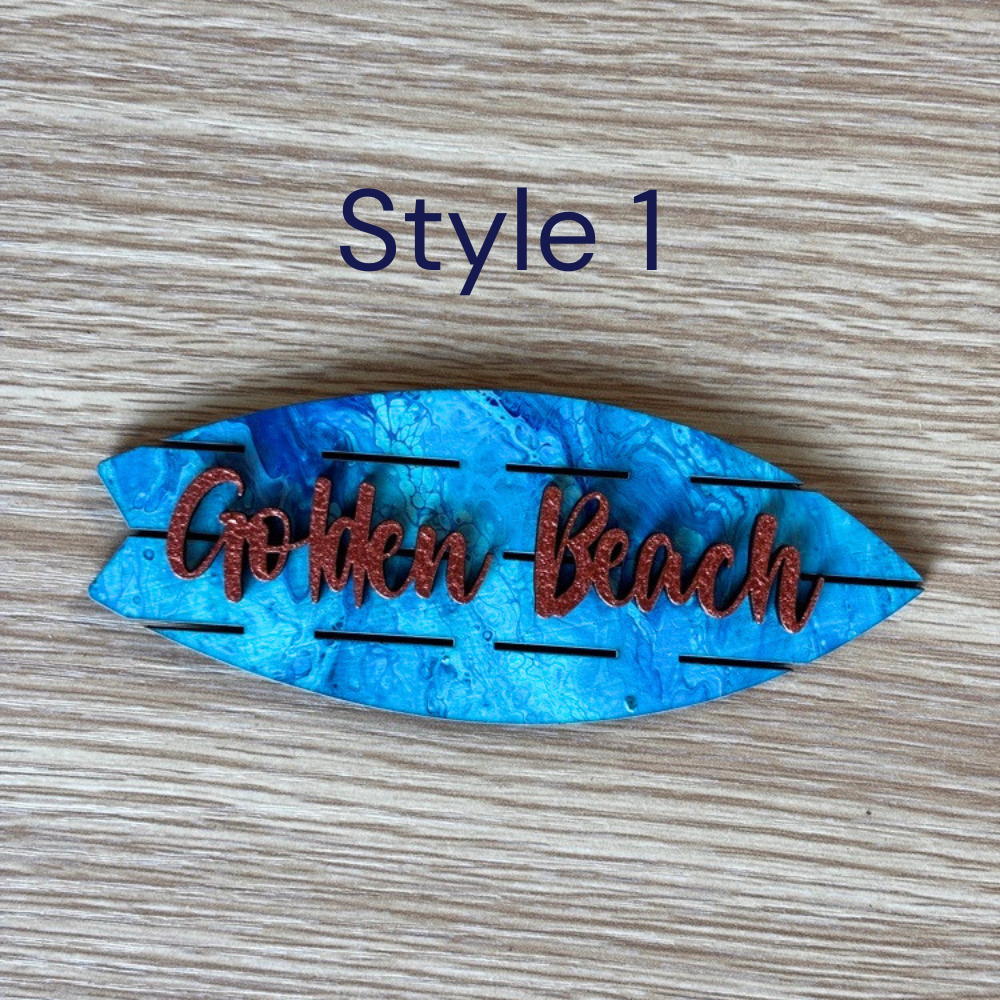 Hand-painted blue wooden souvenir magnet inspired by the beach