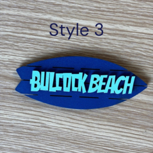 Coastal-style wooden fridge magnet with beach