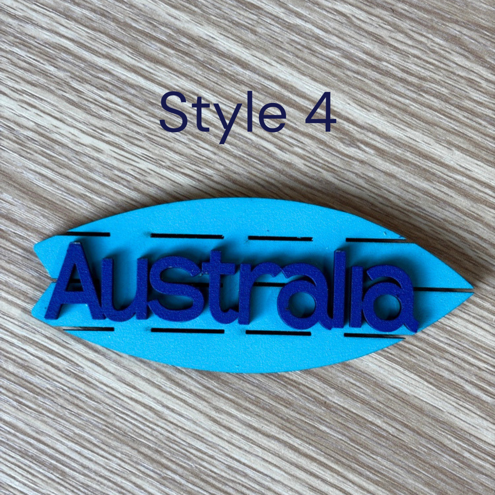Handmade wooden coastal magnet with blue ocean-style artwork
