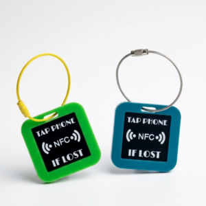Green and blue FLYTAG NFC travel tags with Tap phone if lost text and steel loops